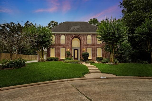 5902 Cardinal Creek Way, Kingwood, TX 77345 - colonial-style house with brick siding and roof with shingles