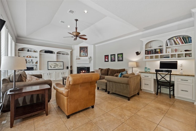 5902 Cardinal Creek Way, Kingwood, TX 77345 - living room with a raised ceiling, ceiling fan, built in shelves, a fireplace, and light tile patterned floors