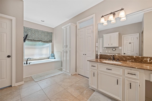 5902 Cardinal Creek Way, Kingwood, TX 77345 - full bathroom with vanity, a bath, a closet, and tile patterned floors