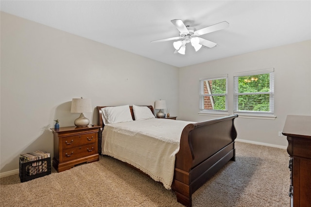 5902 Cardinal Creek Way, Kingwood, TX 77345 - carpeted bedroom featuring baseboards and ceiling fan