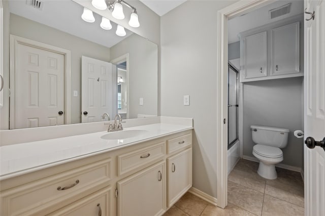 5902 Cardinal Creek Way, Kingwood, TX 77345 - full bath with vanity, toilet, tile patterned floors, enclosed tub / shower combo, and baseboards