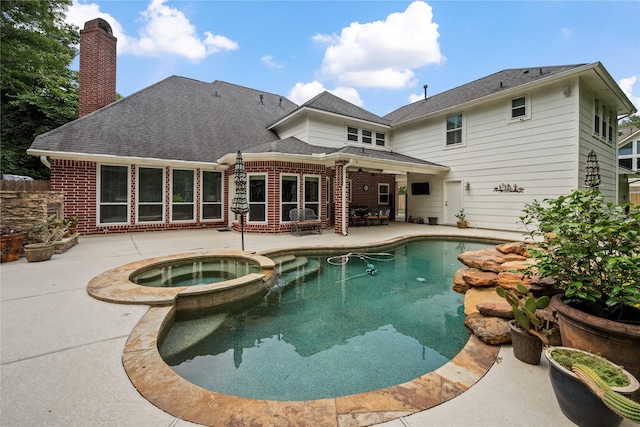 5902 Cardinal Creek Way, Kingwood, TX 77345 - view of pool with a patio and a pool with connected hot tub