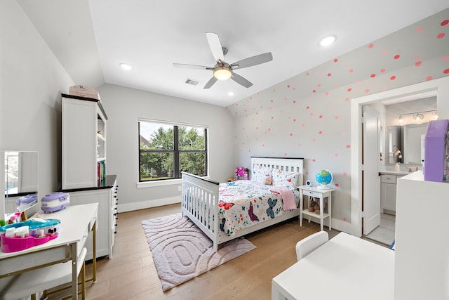 1610 Woodcrest Dr, Houston, TX 77018 - bedroom with light wood-style flooring, baseboards, a ceiling fan, lofted ceiling, and connected bathroom
