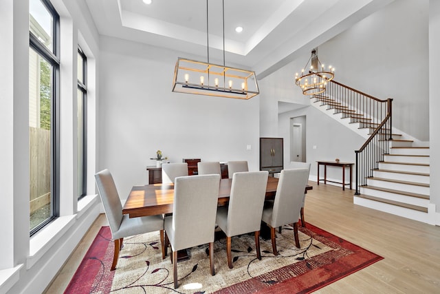 1610 Woodcrest Dr, Houston, TX 77018 - dining space with wood finished floors, stairs, a chandelier, a raised ceiling, and recessed lighting