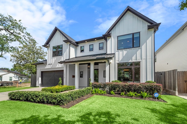1610 Woodcrest Dr, Houston, TX 77018 - view of front of property with board and batten siding, a standing seam roof, a garage, and metal roof