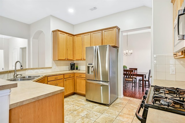 4506 Brazos Bend Dr, Pearland, TX 77584 - kitchen with stainless steel refrigerator with ice dispenser, a sink, backsplash, a chandelier, and light countertops