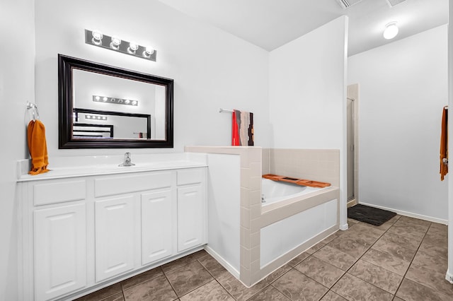 2602 Shady Acres Ct, Houston, TX 77008 - full bathroom with vanity, a garden tub, a shower stall, and tile patterned floors