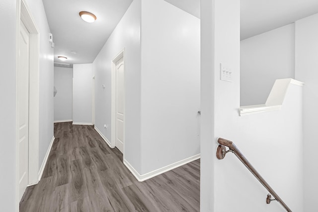 2602 Shady Acres Ct, Houston, TX 77008 - hallway featuring an upstairs landing, wood finished floors, and baseboards