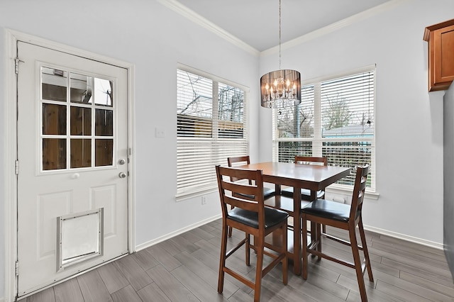 2602 Shady Acres Ct, Houston, TX 77008 - dining space with a chandelier, ornamental molding, healthy amount of natural light, and baseboards