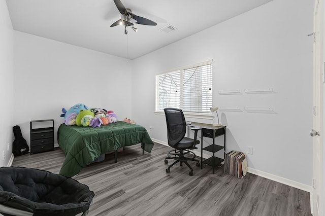 2602 Shady Acres Ct, Houston, TX 77008 - bedroom with wood finished floors, baseboards, and a ceiling fan