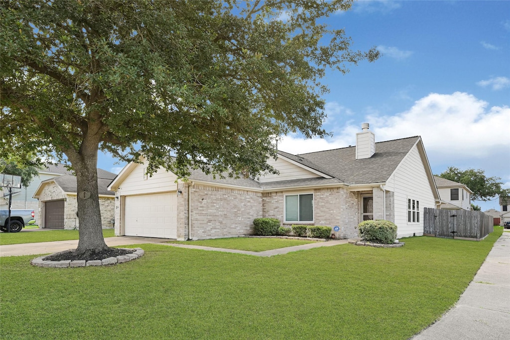 10702 Country Squire Blvd, Baytown, TX 77523 - view of front facade with a chimney, concrete driveway, a garage, brick siding, and a shingled roof