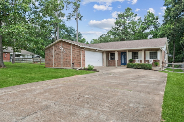 1215 Tejas Blvd, Conroe, TX 77316 - single story home with a porch, brick siding, driveway, and a garage
