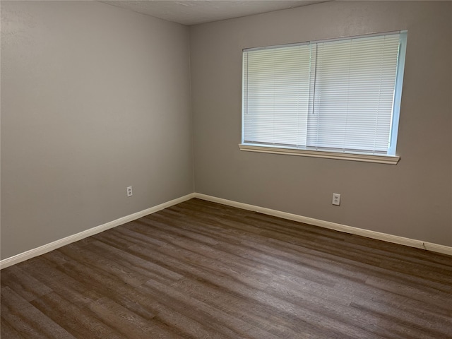 12819 Labelle Ln, Houston, TX 77015 - unfurnished room with dark wood-style flooring and baseboards