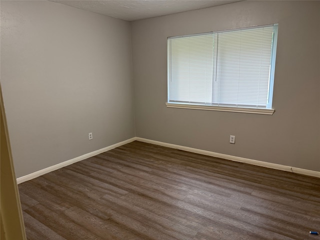 12819 Labelle Ln, Houston, TX 77015 - empty room with dark wood finished floors and baseboards