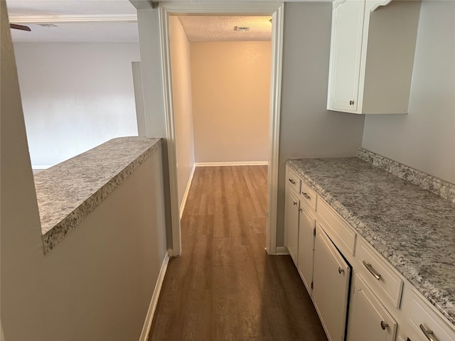 12819 Labelle Ln, Houston, TX 77015 - hallway with dark wood finished floors and baseboards
