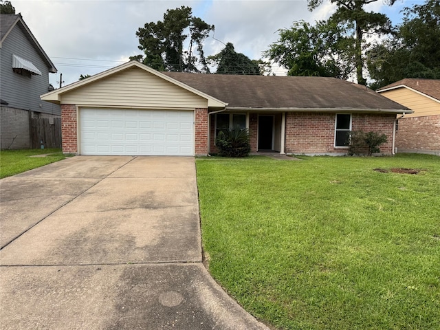 12819 Labelle Ln, Houston, TX 77015 - ranch-style house with a front yard, a garage, brick siding, concrete driveway, and roof with shingles