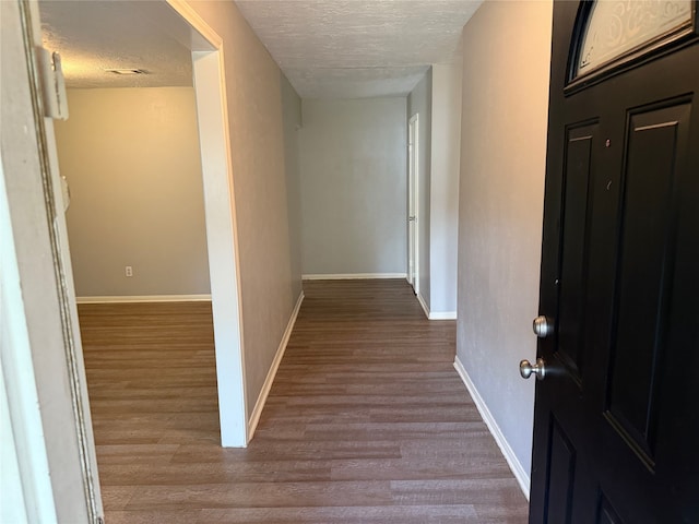 12819 Labelle Ln, Houston, TX 77015 - corridor with a textured ceiling, wood finished floors, and baseboards