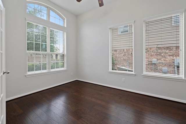 253 Dove Meadow Dr, Conroe, TX 77384 - spare room featuring ceiling fan, dark wood-style floors, and baseboards