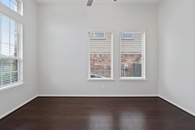 253 Dove Meadow Dr, Conroe, TX 77384 - unfurnished room with dark wood-style floors, ceiling fan, and baseboards