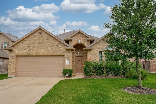 5339 Glenfield Spring Ln, Spring, TX 77389 - view of front of house featuring brick siding, driveway, a front lawn, an attached garage, and a shingled roof