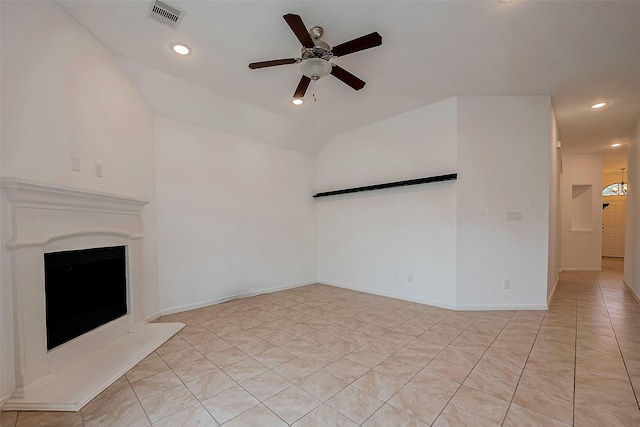5339 Glenfield Spring Ln, Spring, TX 77389 - unfurnished living room featuring a ceiling fan, recessed lighting, light tile patterned flooring, a fireplace with raised hearth, and vaulted ceiling