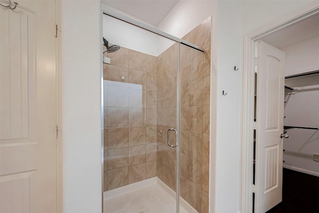 5339 Glenfield Spring Ln, Spring, TX 77389 - bathroom featuring a stall shower and a spacious closet