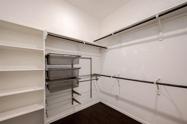 5339 Glenfield Spring Ln, Spring, TX 77389 - walk in closet with dark wood-style flooring