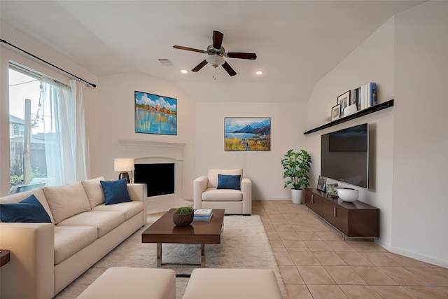 5339 Glenfield Spring Ln, Spring, TX 77389 - living area featuring baseboards, ceiling fan, light tile patterned floors, a fireplace, and lofted ceiling