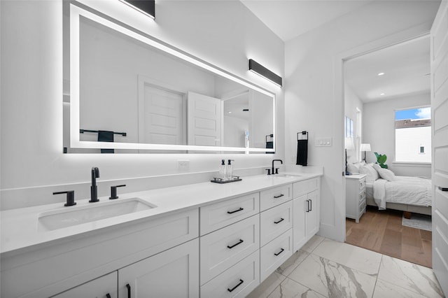 5705 Dolores St Unit B, Houston, TX 77057 - full bath with double vanity, marble finish flooring, ensuite bath, and recessed lighting