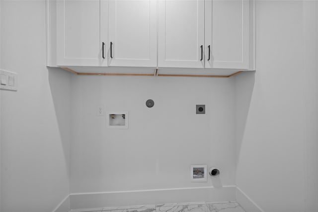 5705 Dolores St Unit B, Houston, TX 77057 - laundry room featuring electric dryer hookup, marble finish floors, hookup for a washing machine, cabinet space, and gas dryer hookup