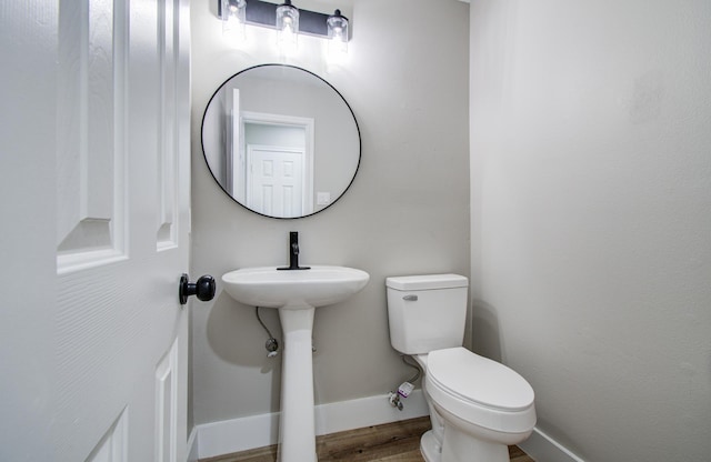 5238 Timber Quail Dr, Humble, TX 77346 - bathroom with baseboards, toilet, and wood finished floors