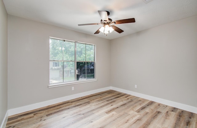 5238 Timber Quail Dr, Humble, TX 77346 - empty room featuring wood finished floors, ceiling fan, and baseboards