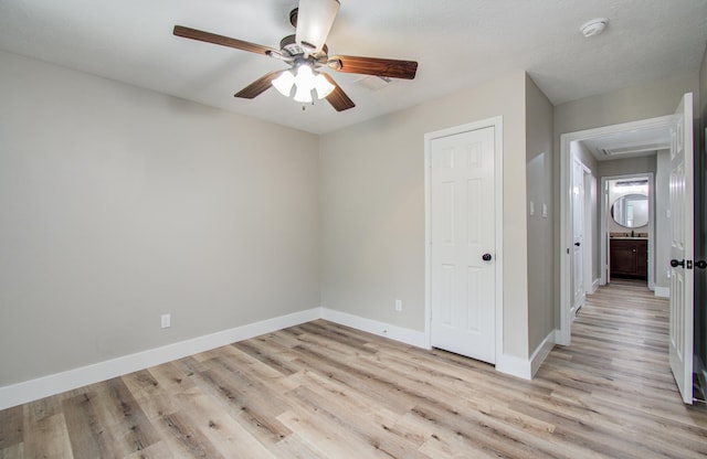 5238 Timber Quail Dr, Humble, TX 77346 - spare room with light wood-type flooring, a ceiling fan, baseboards, a smoke detector, and attic access