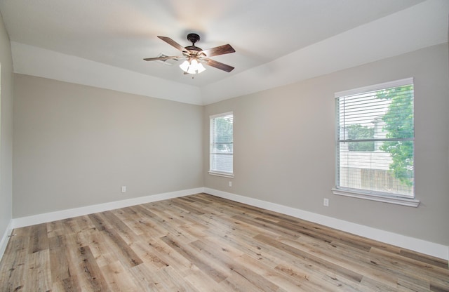 5238 Timber Quail Dr, Humble, TX 77346 - unfurnished room featuring plenty of natural light, light wood-style flooring, a ceiling fan, and baseboards