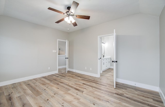 5238 Timber Quail Dr, Humble, TX 77346 - unfurnished bedroom with vaulted ceiling, light wood-style floors, baseboards, a ceiling fan, and ensuite bathroom