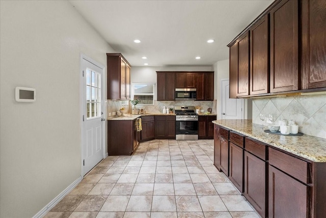 2114 Sand Ridge Dr, Texas City, TX 77568 - kitchen featuring stainless steel appliances, tasteful backsplash, light stone countertops, recessed lighting, and dark brown cabinetry