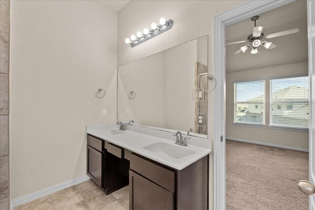 2114 Sand Ridge Dr, Texas City, TX 77568 - bathroom with double vanity, baseboards, and a ceiling fan
