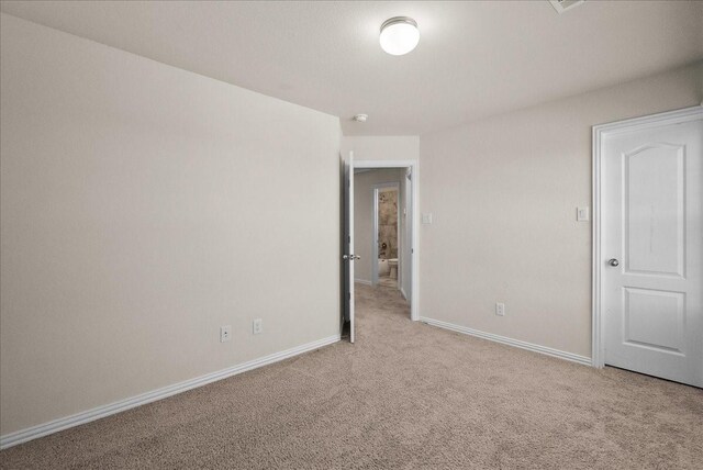 2114 Sand Ridge Dr, Texas City, TX 77568 - unfurnished bedroom featuring carpet flooring and baseboards