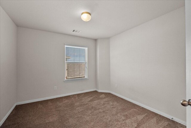 2114 Sand Ridge Dr, Texas City, TX 77568 - spare room with dark carpet and baseboards