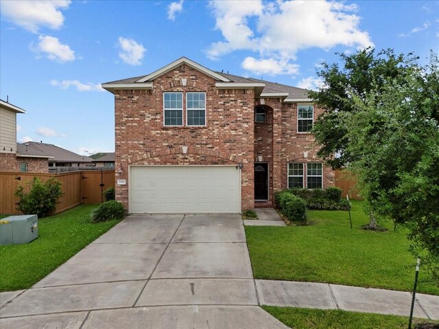 2114 Sand Ridge Dr, Texas City, TX 77568 - traditional-style house featuring brick siding, an attached garage, and concrete driveway