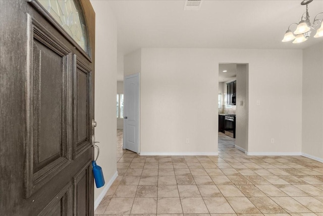 2114 Sand Ridge Dr, Texas City, TX 77568 - entryway with a chandelier and baseboards