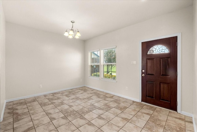 2114 Sand Ridge Dr, Texas City, TX 77568 - foyer with a chandelier, plenty of natural light, and baseboards