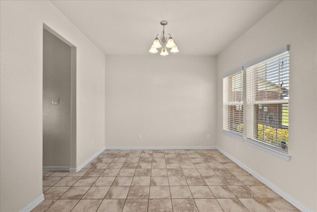 2114 Sand Ridge Dr, Texas City, TX 77568 - spare room with a chandelier and baseboards