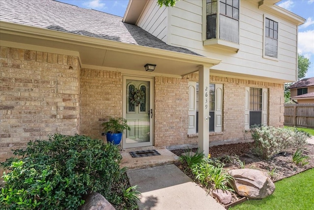 2639 Valley Field Dr, Sugar Land, TX 77479 - view of exterior entry with brick siding and roof with shingles