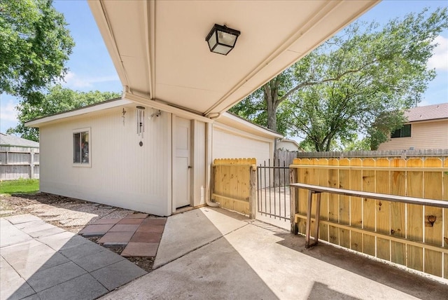 2639 Valley Field Dr, Sugar Land, TX 77479 - view of patio with a garage and a gate