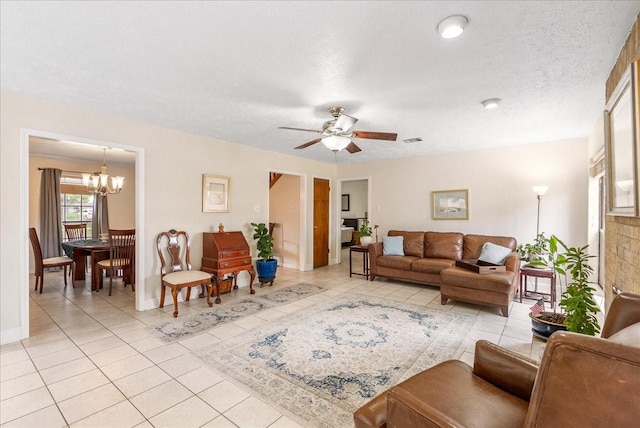 2639 Valley Field Dr, Sugar Land, TX 77479 - living area with a chandelier, light tile patterned floors, a ceiling fan, and baseboards