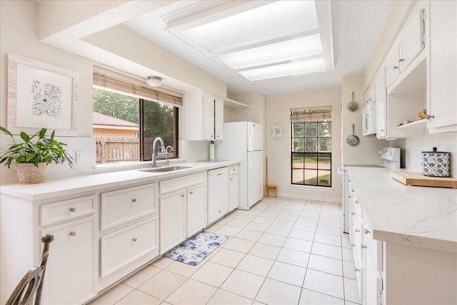2639 Valley Field Dr, Sugar Land, TX 77479 - kitchen with a sink, white appliances, healthy amount of natural light, and white cabinets