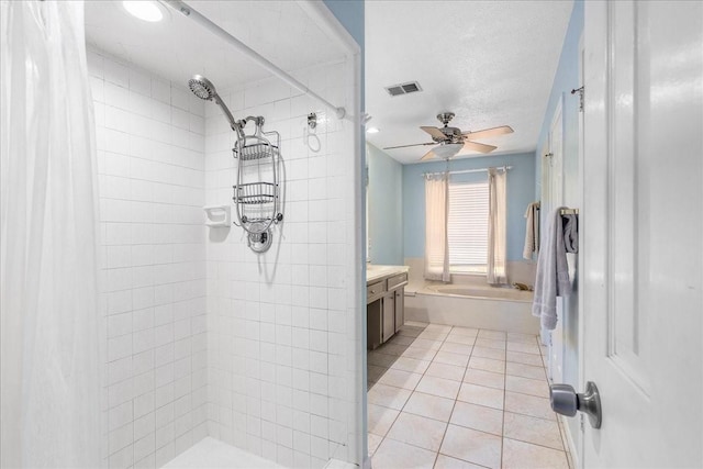 2639 Valley Field Dr, Sugar Land, TX 77479 - bathroom featuring tiled shower, tile patterned floors, a ceiling fan, vanity, and a garden tub