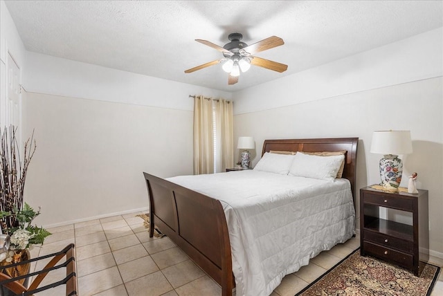 2639 Valley Field Dr, Sugar Land, TX 77479 - bedroom featuring light tile patterned flooring, ceiling fan, and baseboards