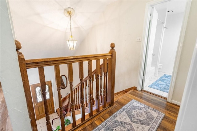 2639 Valley Field Dr, Sugar Land, TX 77479 - stairs featuring wood finished floors and baseboards